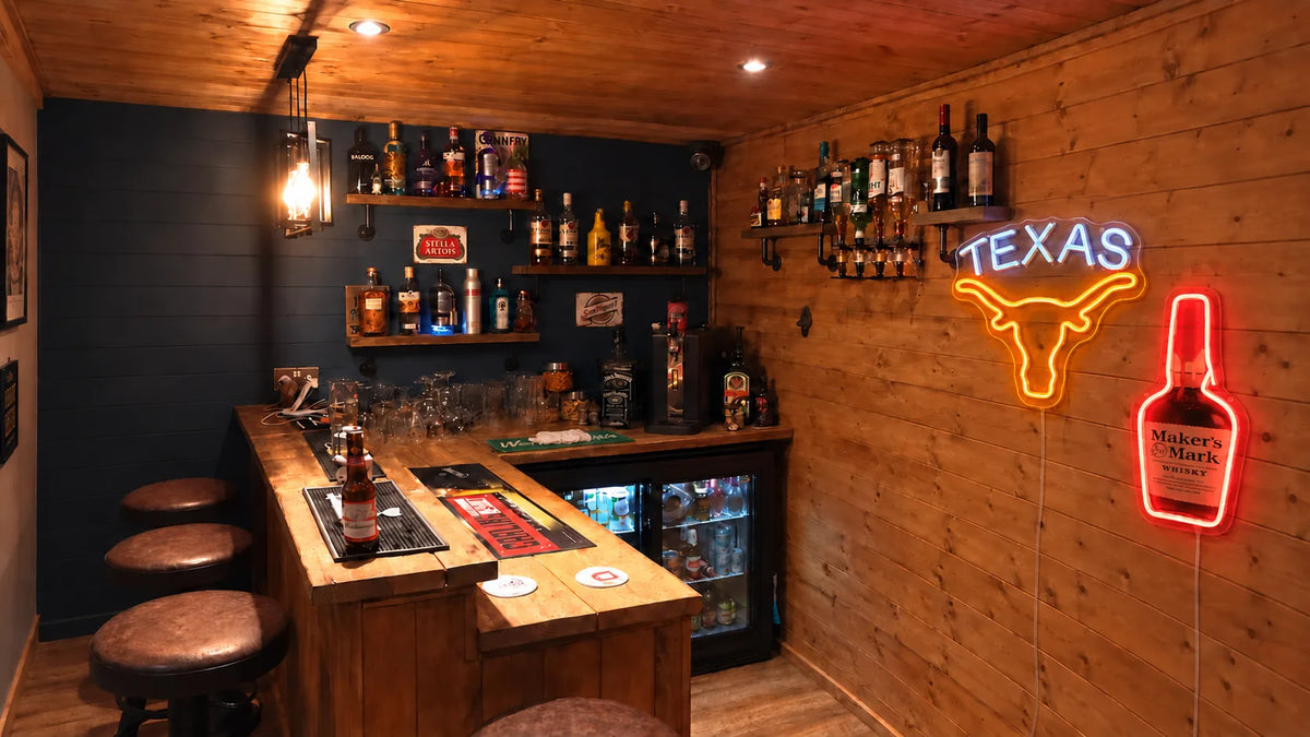 Home bar with Texas longhorn and whiskey neon signs and discreet translucent power cords
