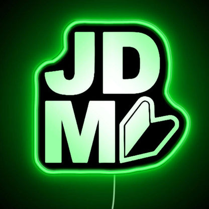 Jdm Logo Neon Sign - Neon sign mounted on wall in room