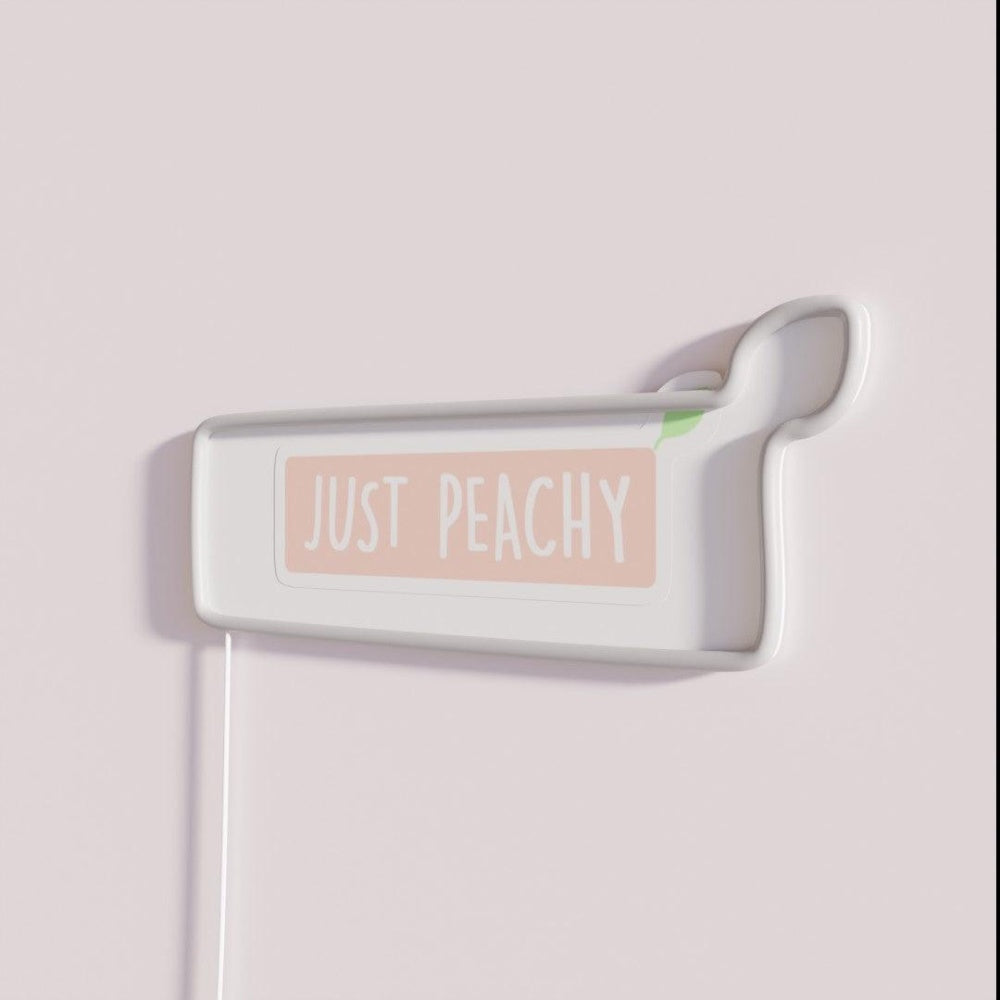 Just Peachy Rgb Led Neon Sign - Neon sign mounted on wall in room
