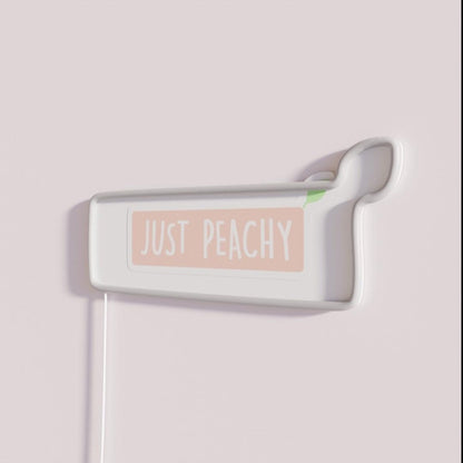 Just Peachy Rgb Led Neon Sign - Neon sign mounted on wall in room