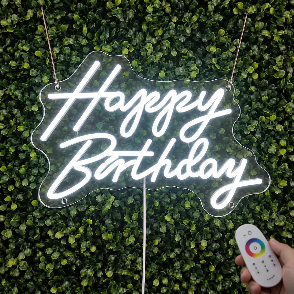 Happy Birthday neon sign lit for testing, with the supplied remote control.