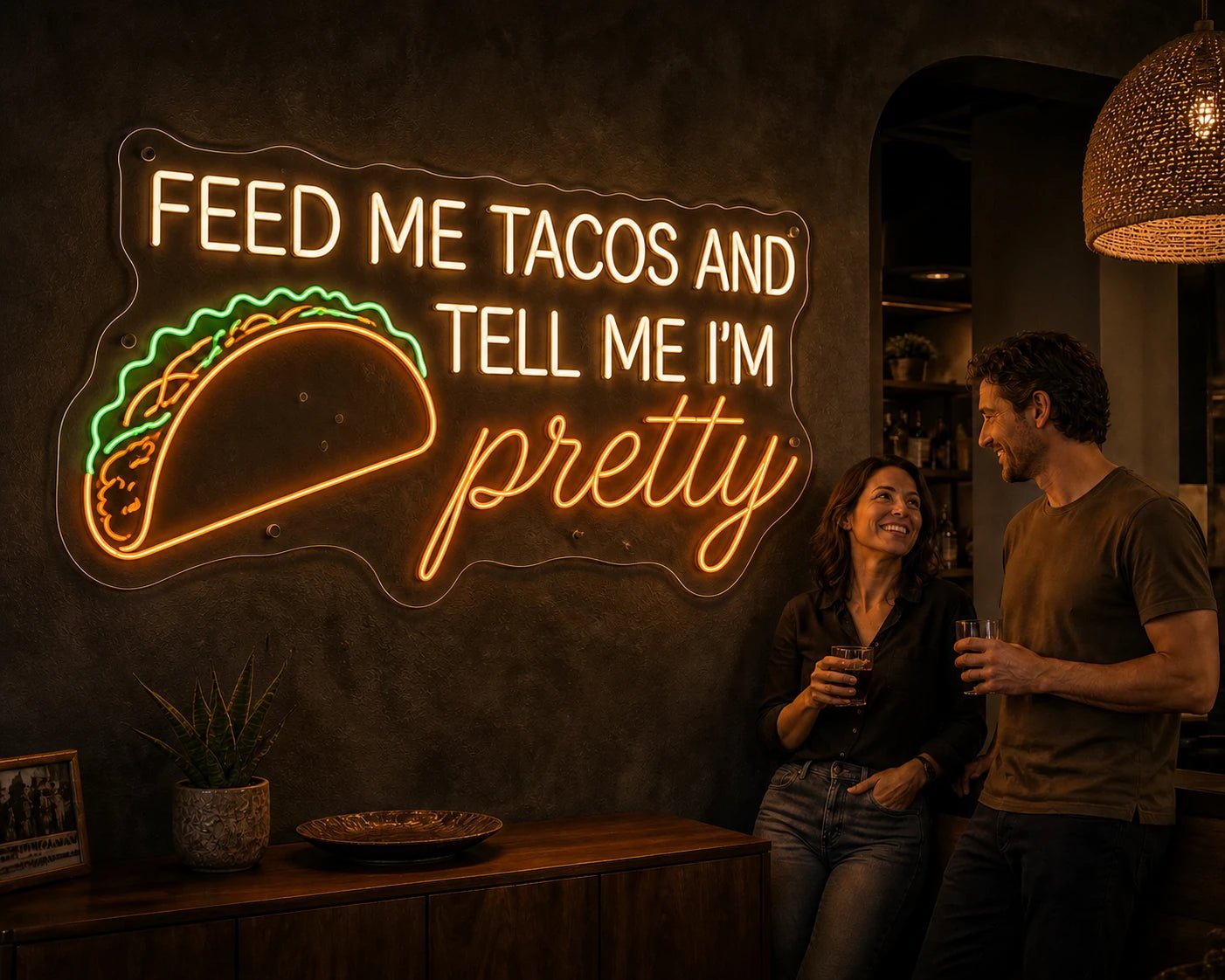 Customers beside a crisp Feed Me Tacos and Tell Me I'm Pretty Pure LED neon sign